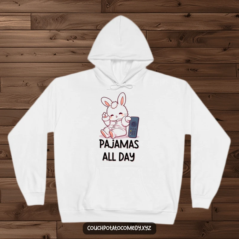Funny hoodie with a fluffy bunny wearing oversized pajamas, lazily reaching for a remote control, embodying ultimate comfort and relaxation.